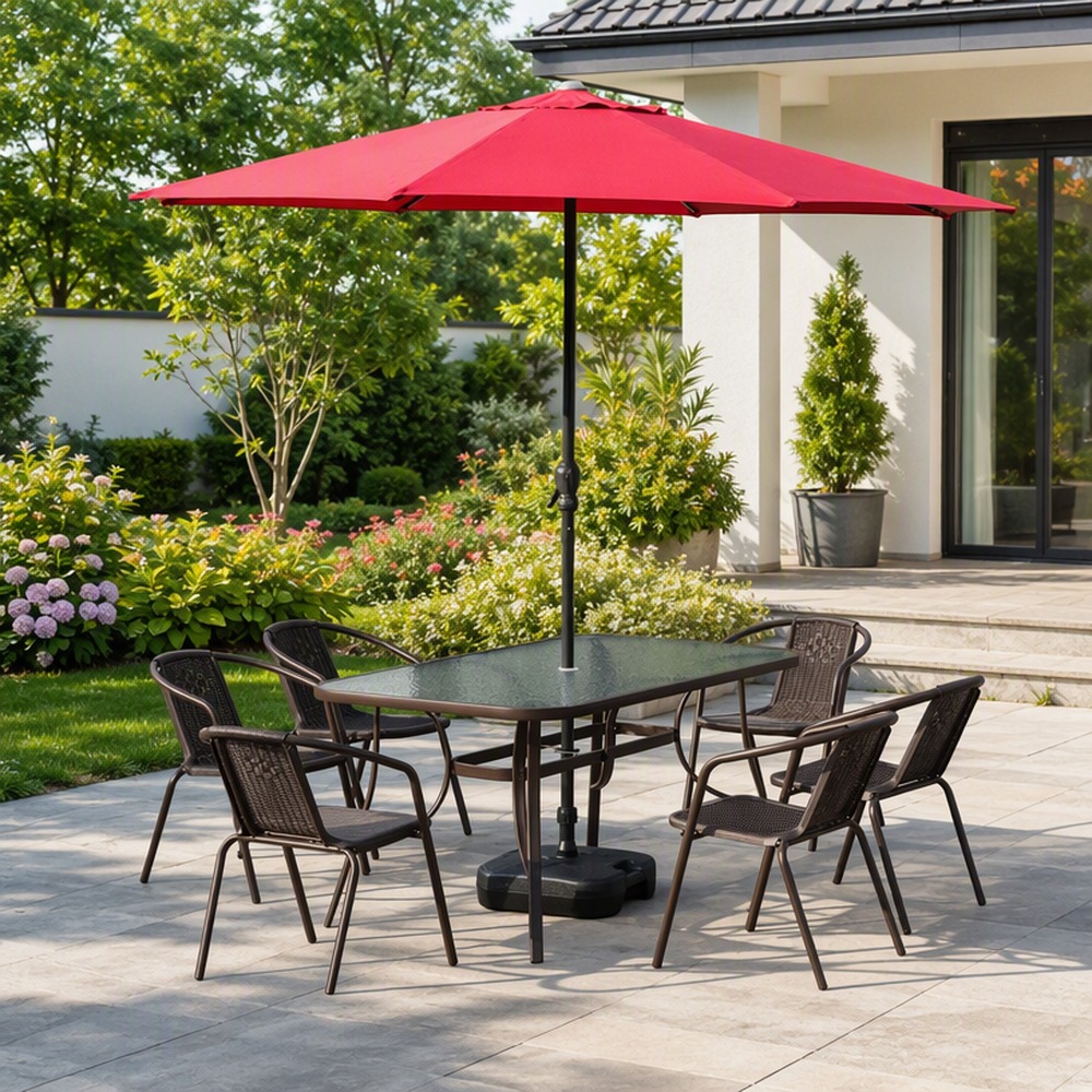 Outdoor dining set under a red cantilever umbrella on a terrace